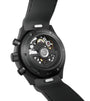 Black chronograph watch with visible skeleton dial showing gears and mechanisms, numbered edition, black rubber strap.