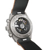 Titanium chronograph watch with visible skeleton movement, black leather strap, and numbered edition marking on case back.