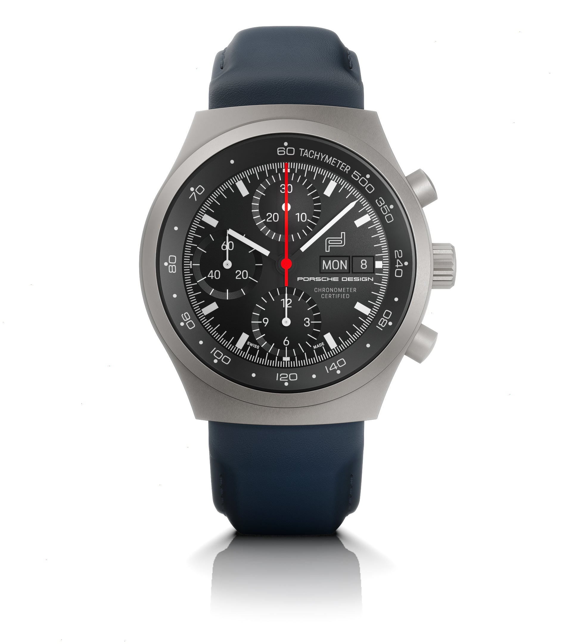 Titanium chronograph watch with black dial, tachymeter bezel, date window, and dark blue rubber strap.