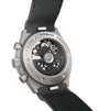 Titanium chronograph watch with exposed movement, black leather strap, and numbered edition marking on silver case back.
