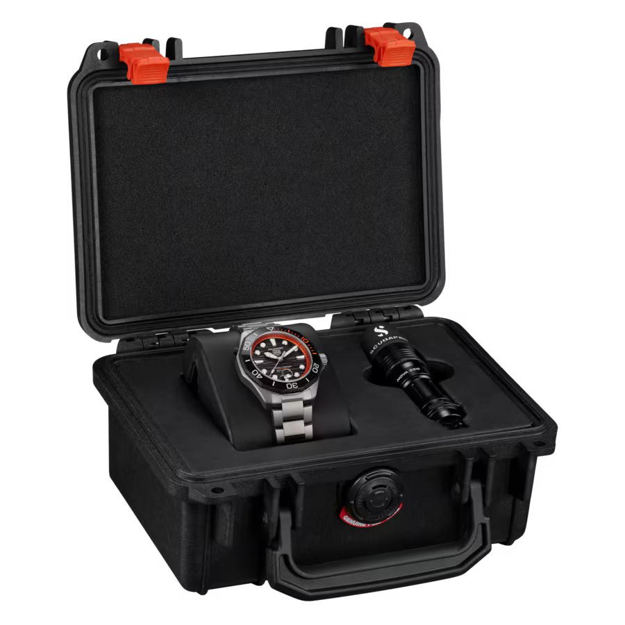 Black protective case with red latches containing Aquaracer Professional 500 Date watch and black lens accessory.