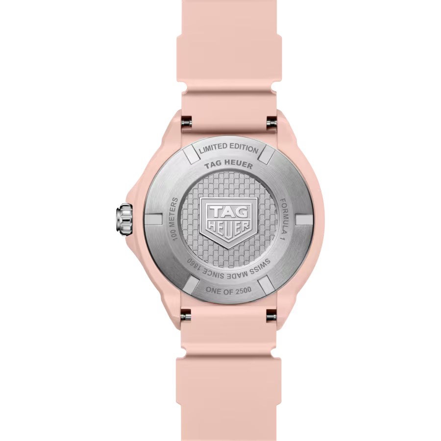 Tag Heuer watch with pink strap and silver case on a white background