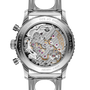 Stainless steel chronograph watch caseback with visible mechanical movement, purple jewels, and gold accents.