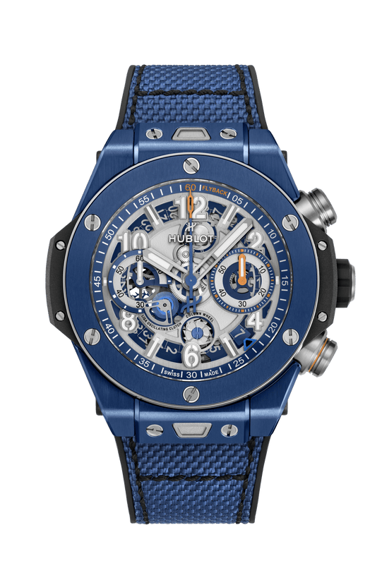 Blue ceramic chronograph watch with exposed movement, skeleton dial, Arabic numerals, blue fabric strap, and steel pushers.