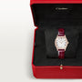 Cartier Tortue Small Model watch with rose gold case, white dial, Roman numerals, and burgundy leather strap in red presentat