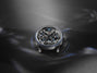 Luxury watch with intricate design on a dark background