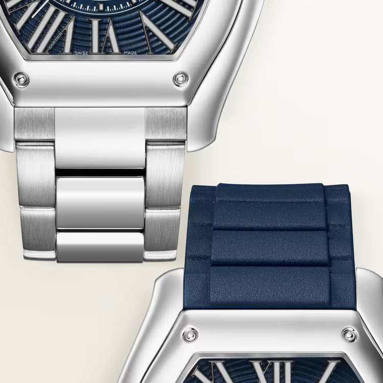 Silver and stainless steel watch with blue dial and matching navy blue rubber strap shown from above.