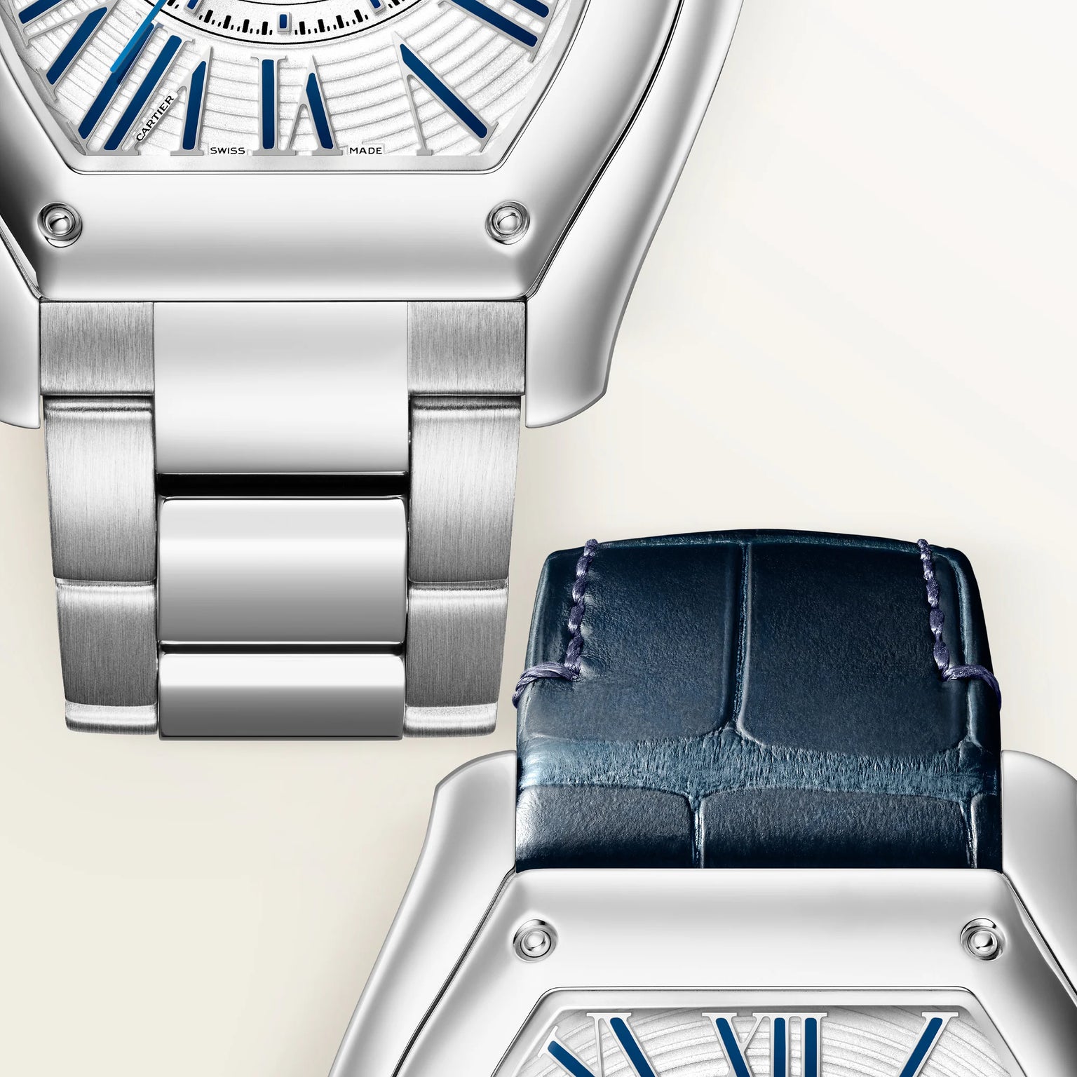 Silver-tone watch with white dial, blue Roman numerals, and matching silver metal bracelet, shown from above with navy leathe
