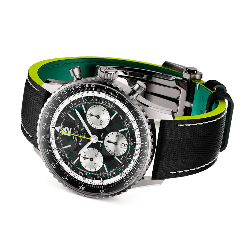Luxury watch with a black and green strap on a white background