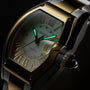 Cartier Roadster watch with tonneau-shaped case in two-tone gold and steel, cream dial with Roman numerals, and turquoise han