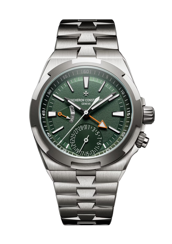 Stainless steel watch with green dial, dual time subdial, orange cardinal point indicator, and matching metal bracelet.