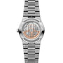 Stainless steel watch with visible rose gold mechanism, three-link bracelet, and transparent caseback displaying intricate mo
