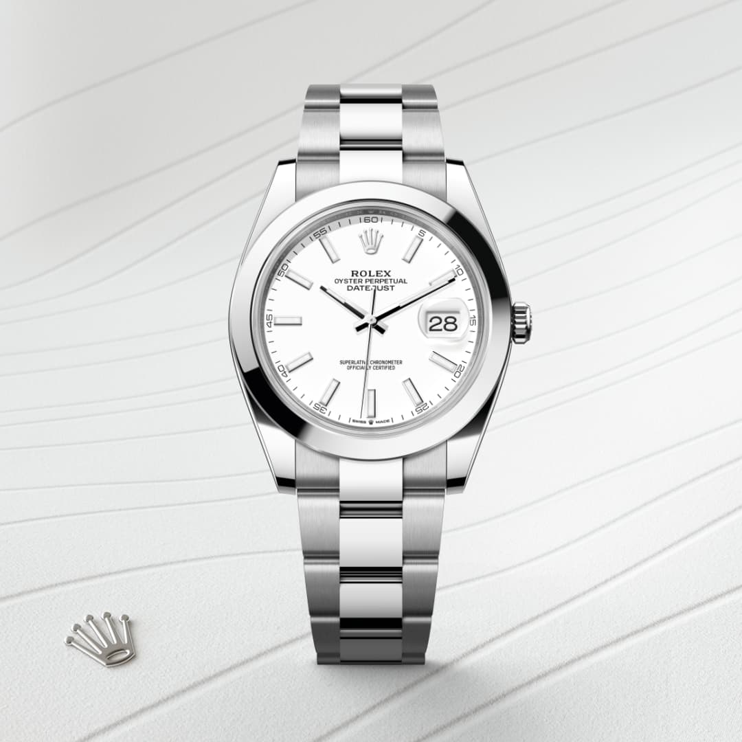 Silver Rolex wristwatch with a white dial and date display, placed on a light, textured background.