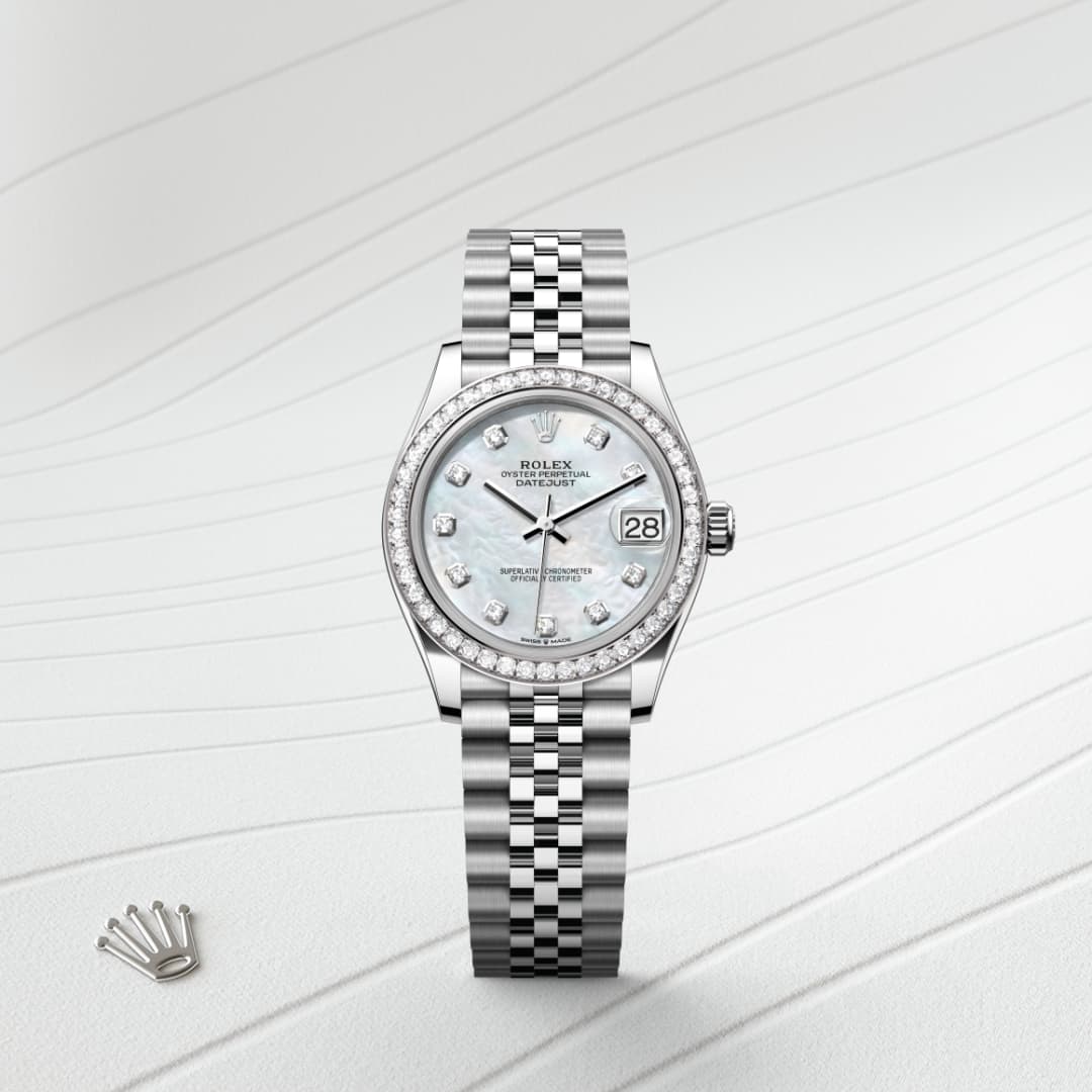 Silver Rolex watch with diamond markers and a metal band on a light, textured background with a crown logo nearby.