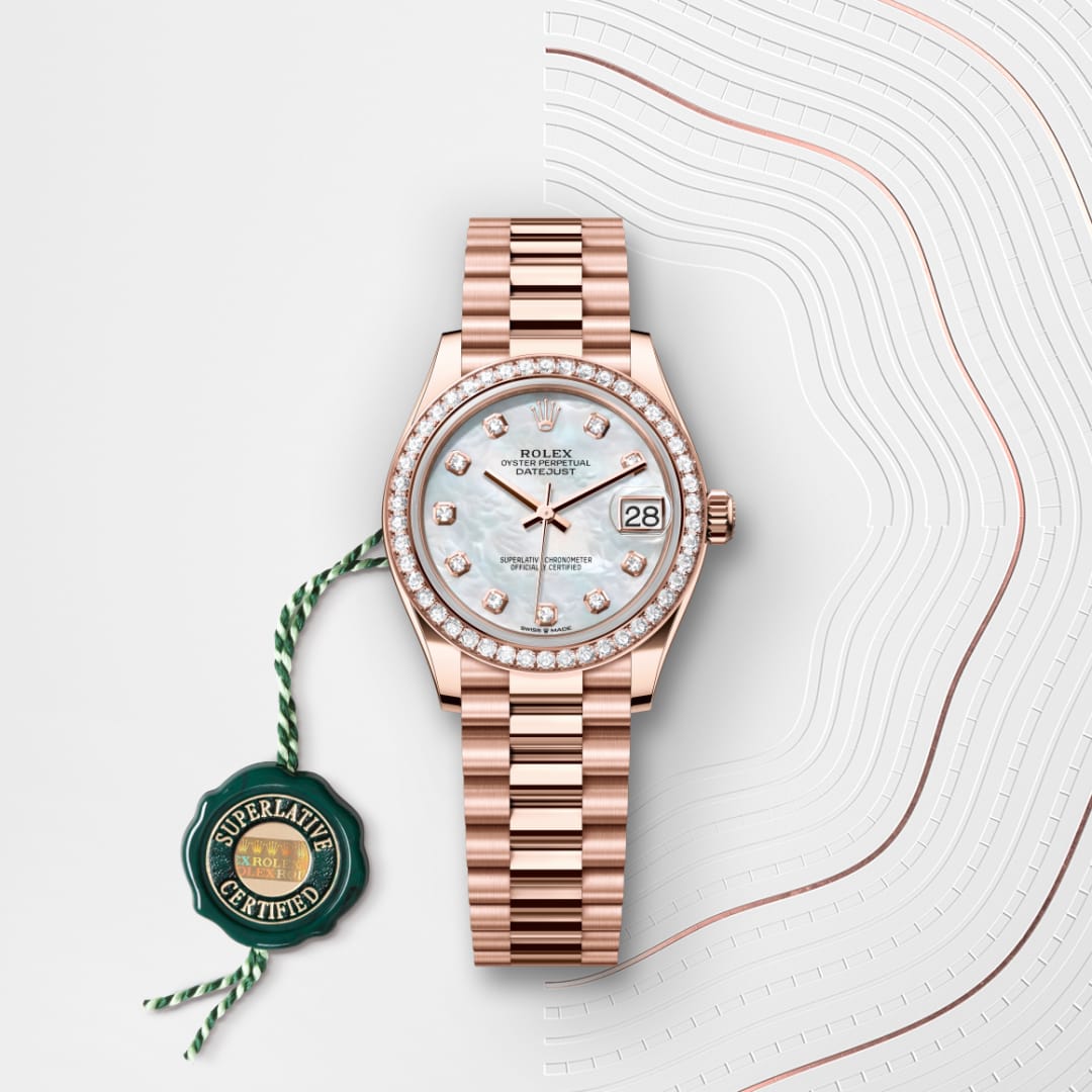 A rose gold Rolex watch with diamond bezel and green certification tag on a patterned white background.