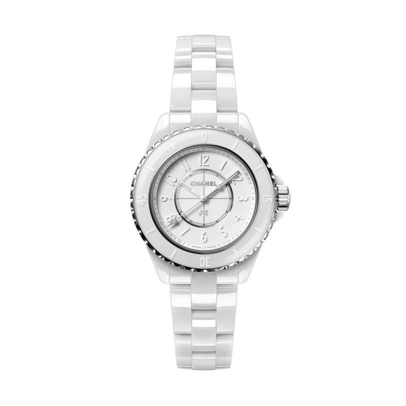 The Chanel J12 Phantom is a white wristwatch featuring a round face, silver-tone hour markers, and a highly resistant ceramic link bracelet, shown against a plain light background.