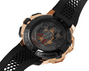 Rose gold and black chronograph watch with visible mechanical movement through transparent case back and perforated rubber st