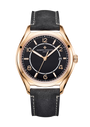 Rose gold watch with black dial, Arabic numerals, date window, and black leather strap with white stitching.
