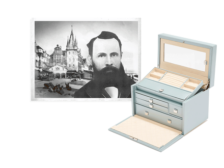 A vintage portrait of a bearded man next to an open, light blue jewelry box with multiple compartments.