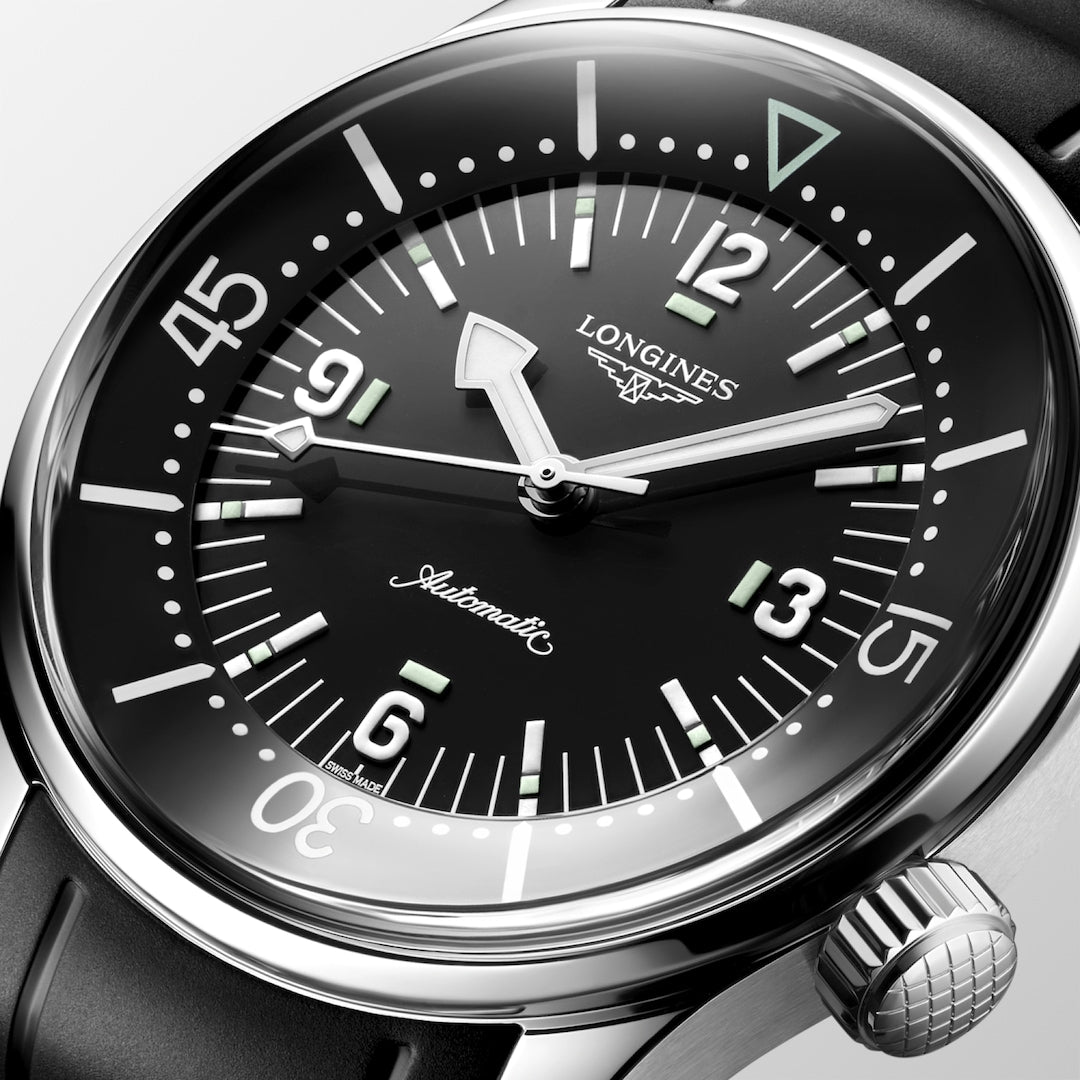Close-up of the Longines Legend Diver automatic wristwatch featuring a black dial and luminous markers.