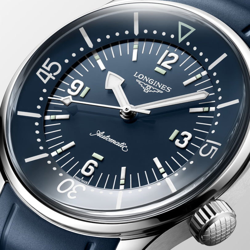 Close-up of a blue Longines Legend Diver automatic wristwatch featuring large numbers and luminous markers.