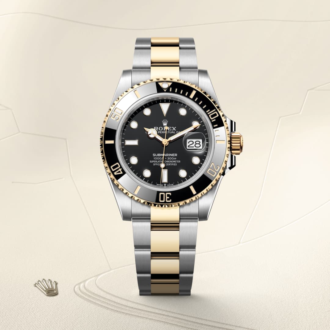 A Rolex Submariner watch with a black dial and two-tone silver and gold bracelet on a beige background.