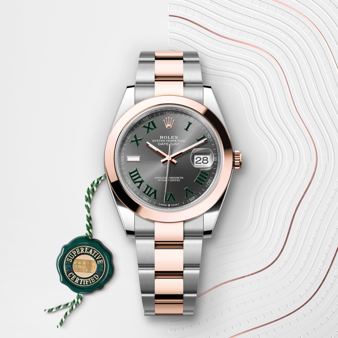 A Rolex Datejust watch with a silver and rose gold band on a white textured background with a certification tag.