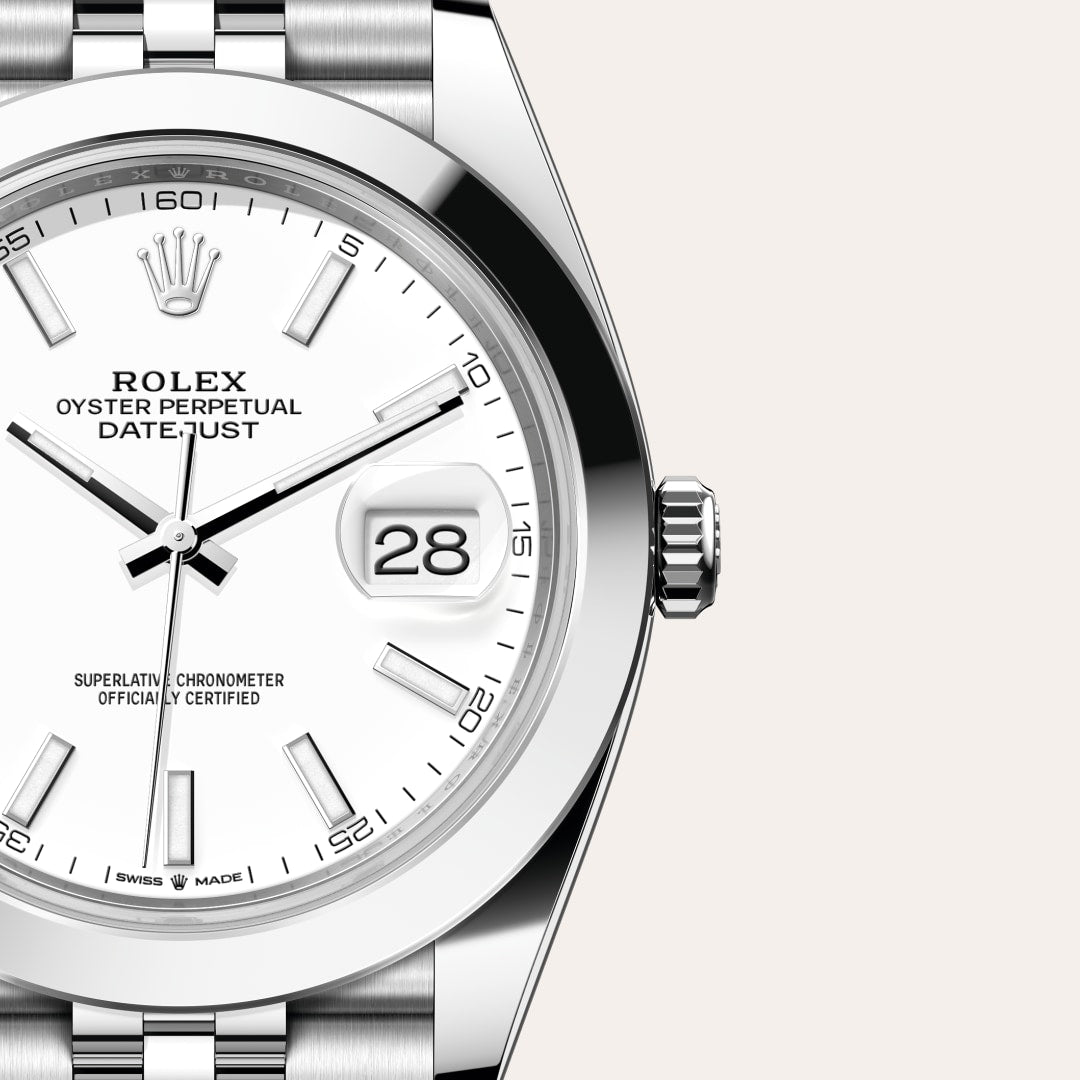 Close-up of a Rolex Oyster Perpetual Datejust watch with a white dial and a date window showing the 28th.
