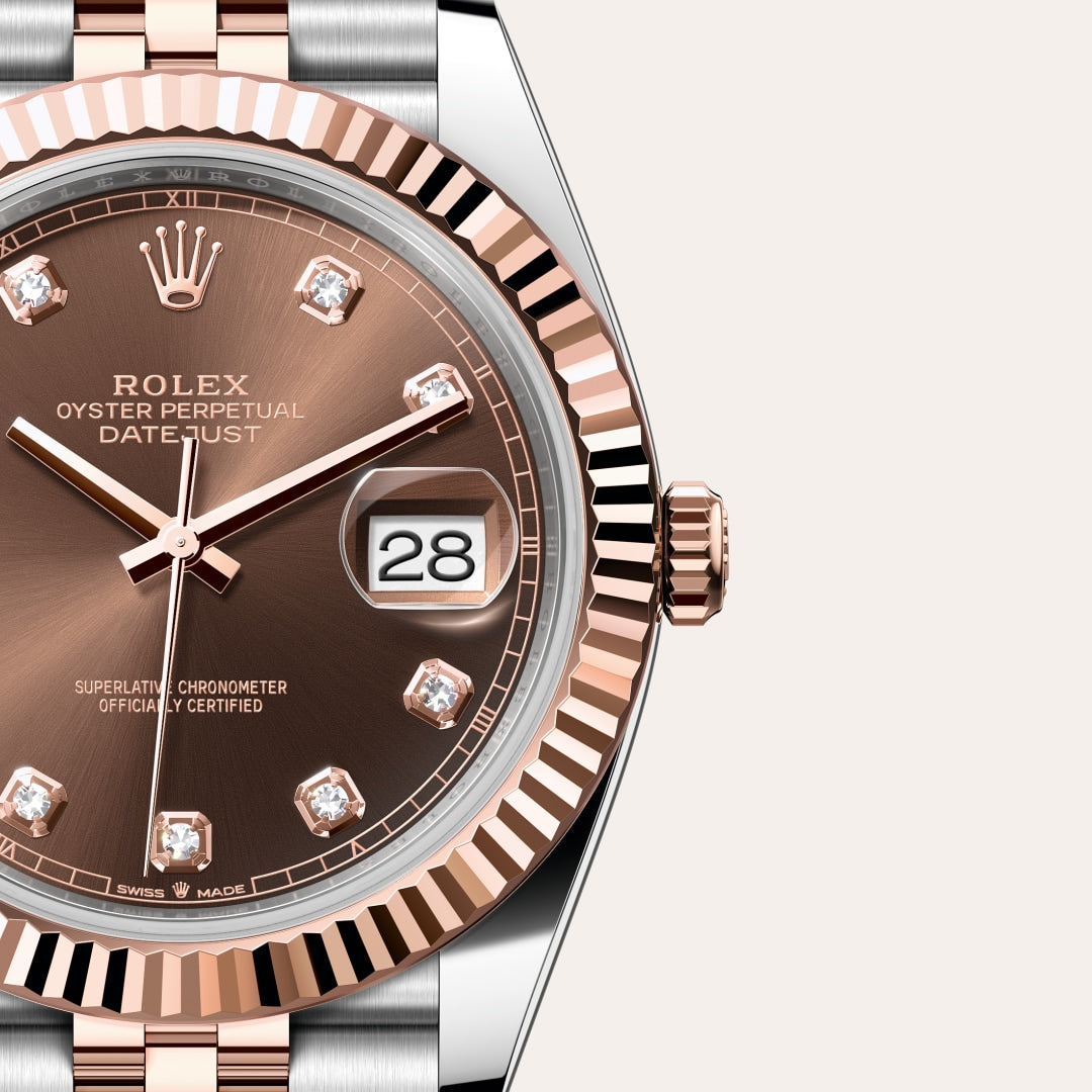 Close-up of a Rolex Datejust watch with a brown dial, diamond hour markers, and a date display at 3 oclock.