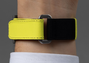 A close-up of a wrist wearing the Gerald Charles Maestro GC Sport Tennis Limited Edition yellow and black fabric watch strap with a metal loop.
