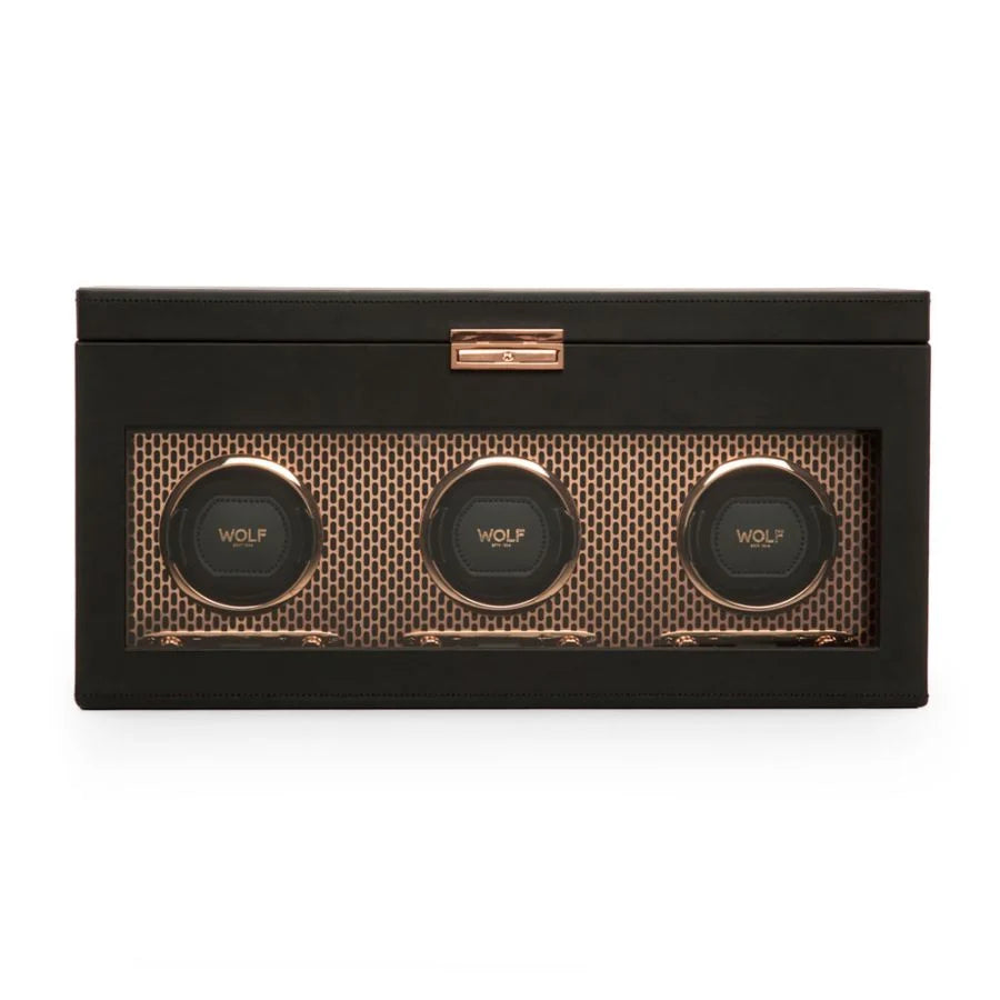 Black watch winder box with three rotating watch holders and rose gold accents.