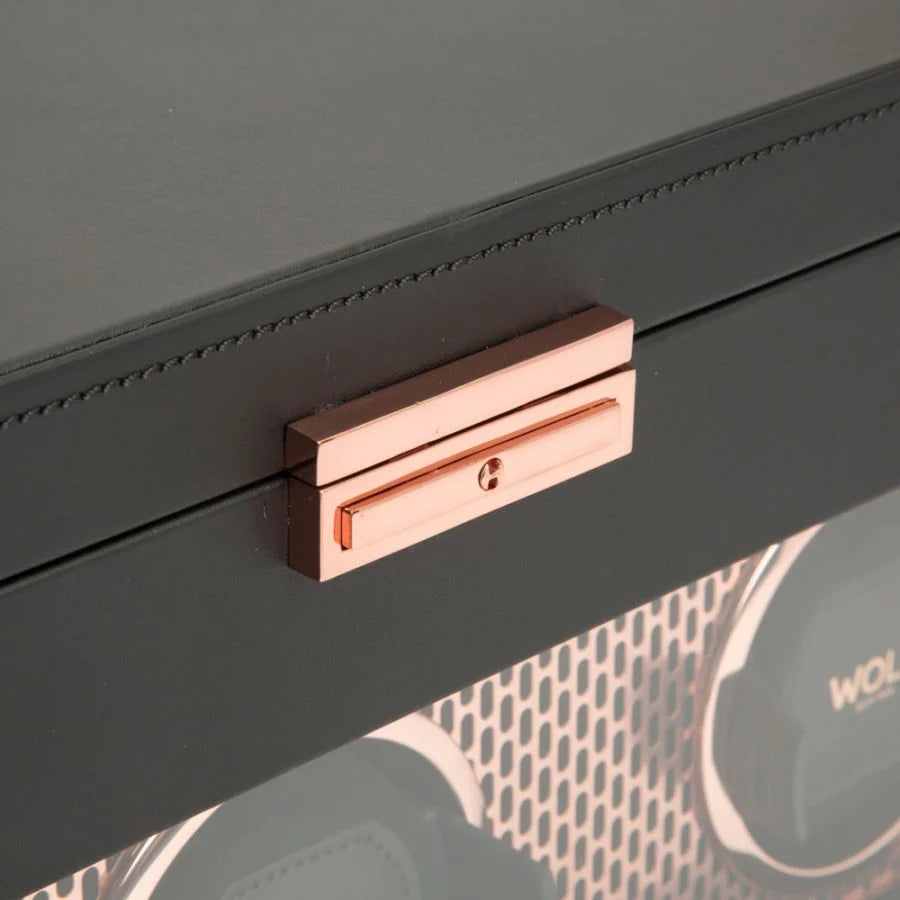 Black watch winder box with rose gold handle and stitched leather exterior detail.