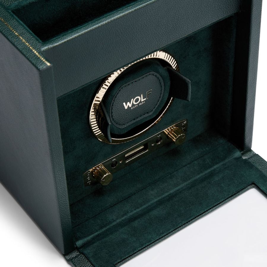 Green leather watch winder with gold-tone mechanism and storage drawer, branded Wolf.