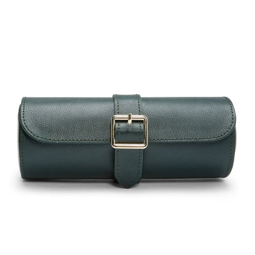 Teal leather watch roll with three compartments and rectangular buckle closure.
