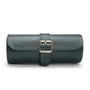 Teal leather watch roll with three compartments and rectangular buckle closure.