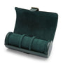 Dark green suede watch roll with three compartments, metal clasp, and leather trim.