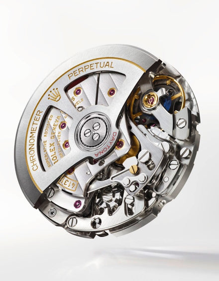 Close-up of a Rolex mechanical watch movement with intricate gears, levers, and engraved markings.