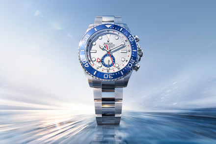 Luxury watch with blue and silver accents on a reflective surface with a blue gradient background