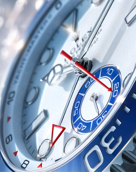 Close-up of a watch face with blue and silver design