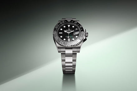 Rolex GMT-Master II on green gradient background