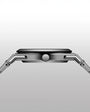 Close-up of a silver smartwatch on a light gray background