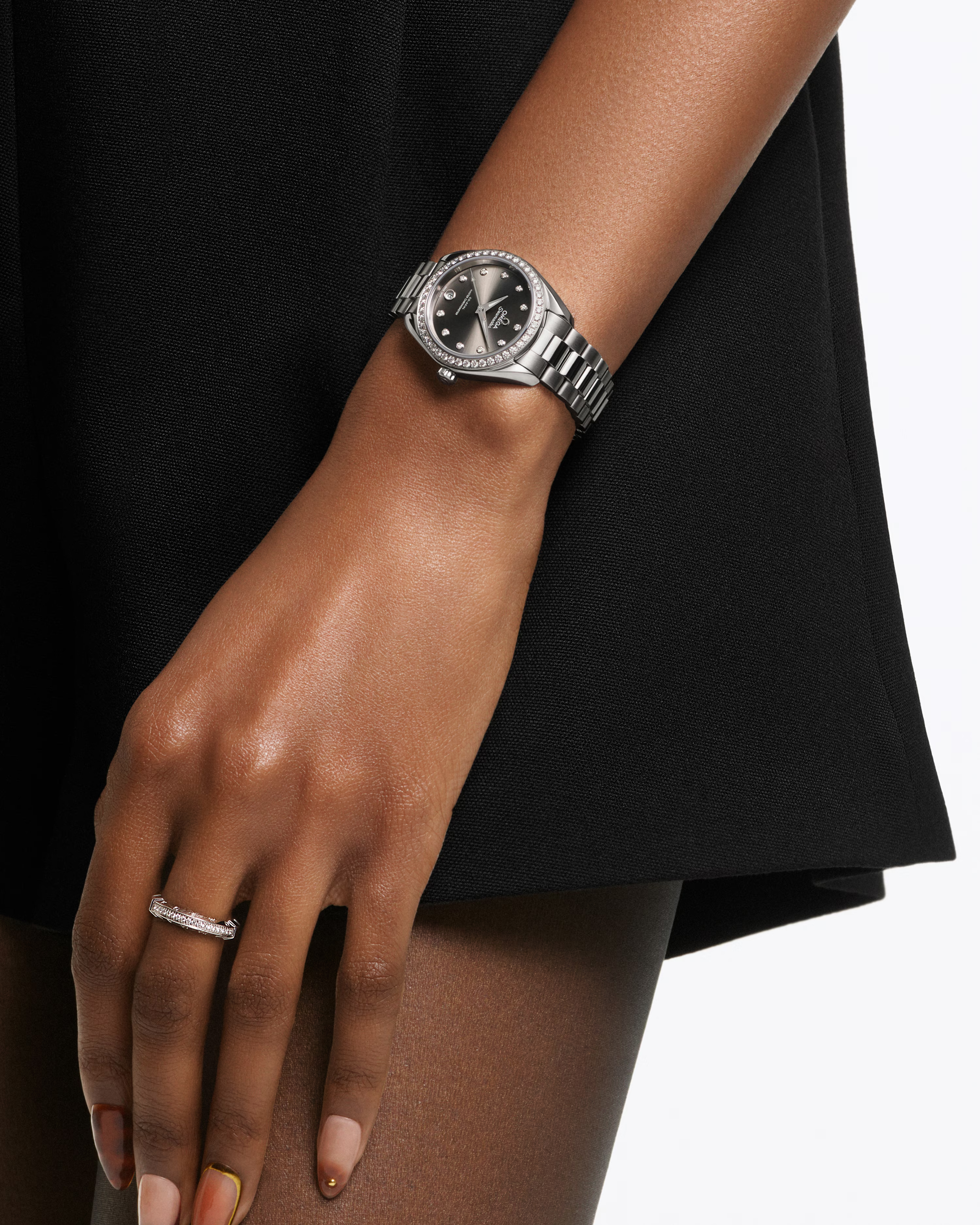 Model wearing the OMEGA Seamaster Aqua Terra 150M 30mm Steel on Steel Diamond Bezel Diamond Markers Grey Dial Watch 